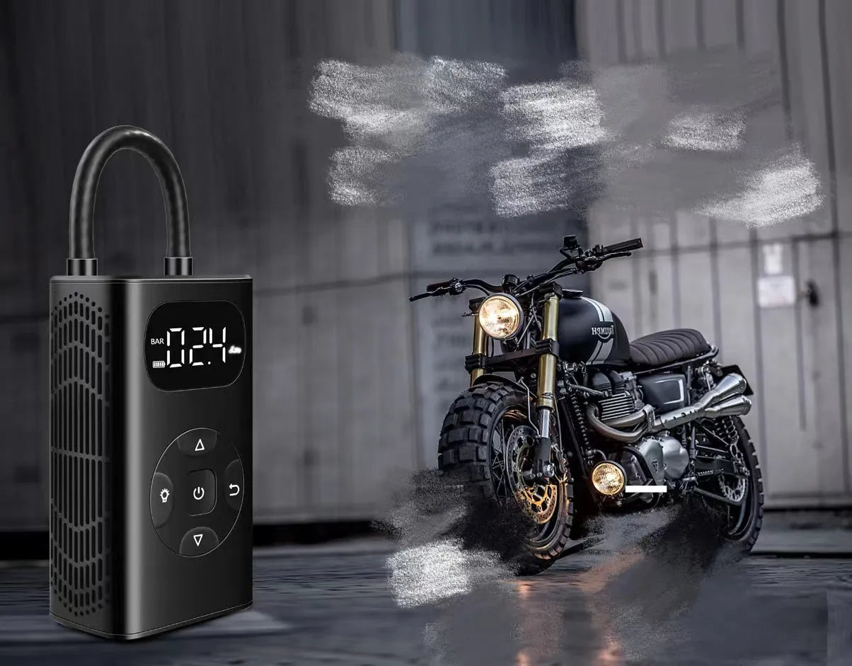 Black M09X portable power bank tyre inflator with 16cm tube next to car and motorcycle tyres