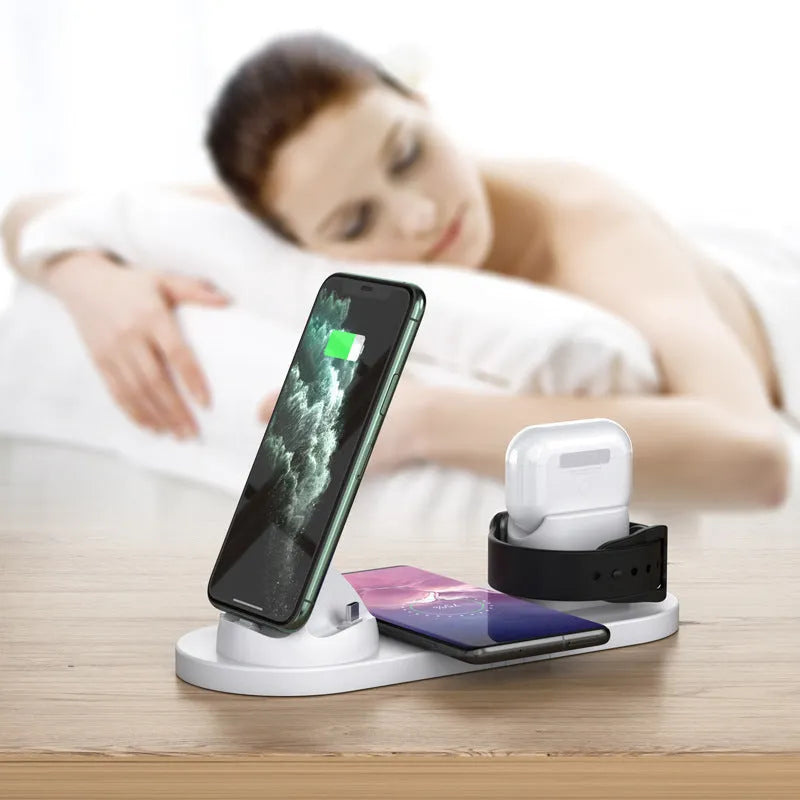 Black 6-in-1 wireless charging station organising a phone, Apple Watch and AirPods on a desk