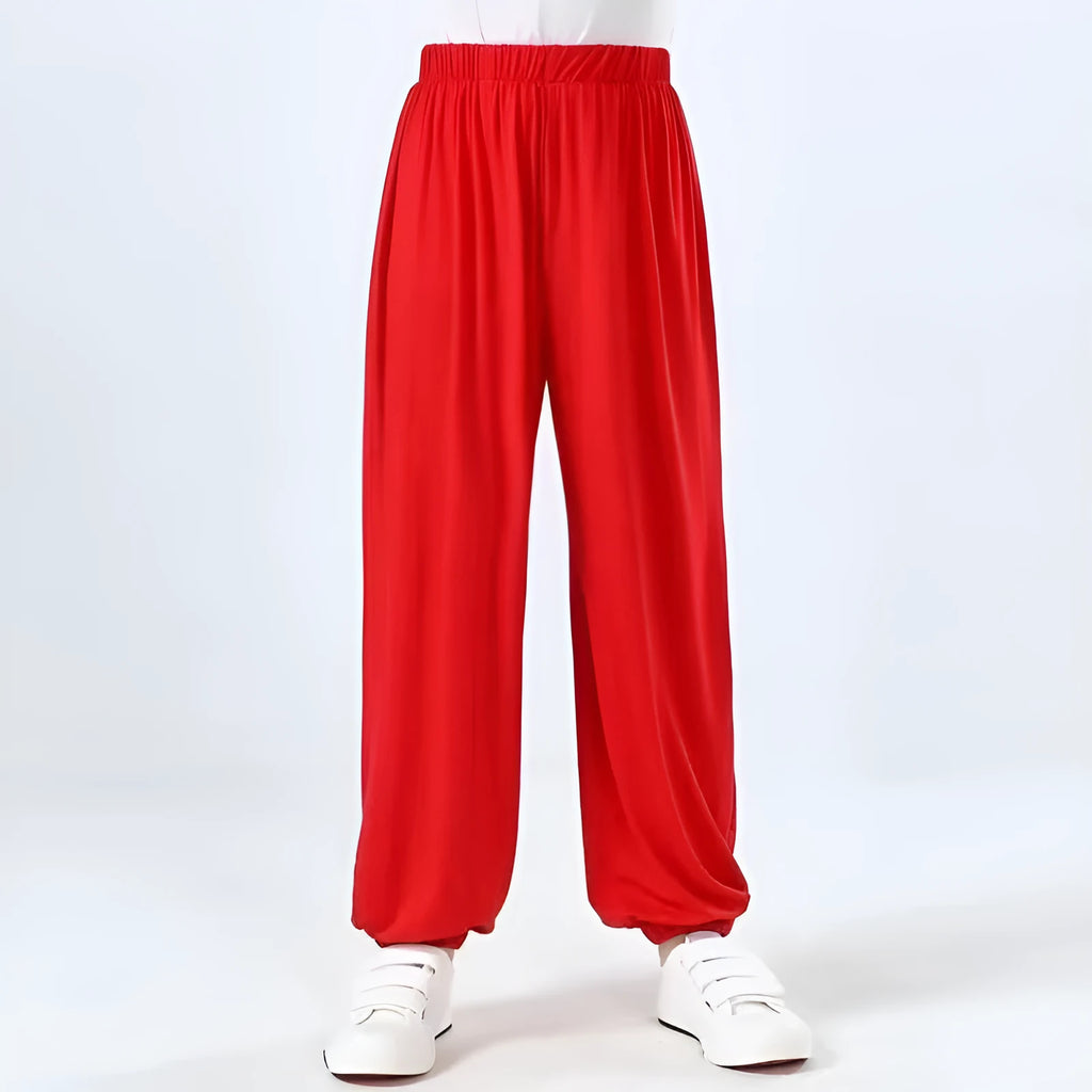 Child wearing black high elasticity Sanda practice pants made from spandex Lycra for martial arts training.