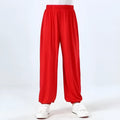 Child wearing black high elasticity Sanda practice pants made from spandex Lycra for martial arts training.