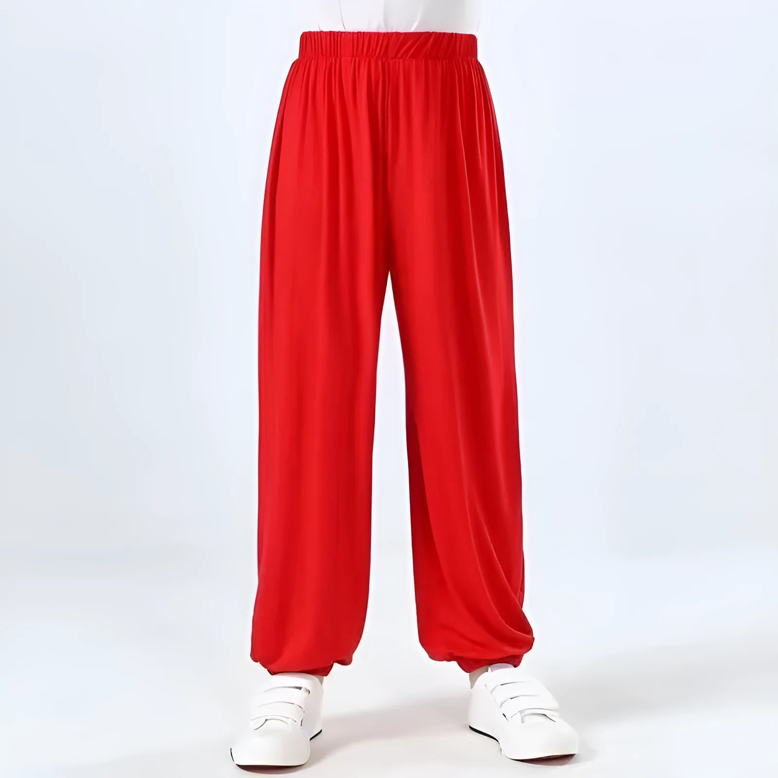 Child wearing black high elasticity Sanda practice pants made from spandex Lycra for martial arts training.