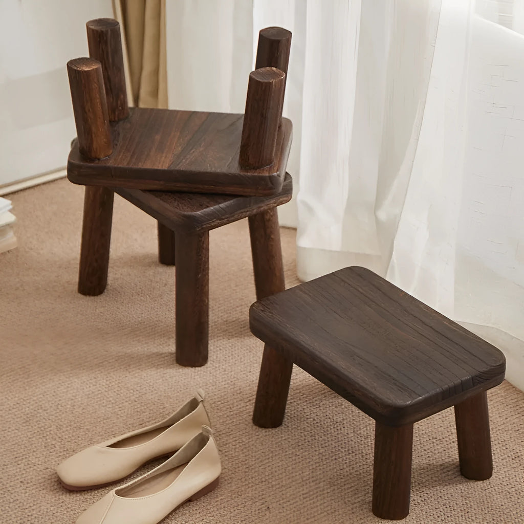 Solid wood distressed finish shoe changing stool with bracket structure for the living room.
