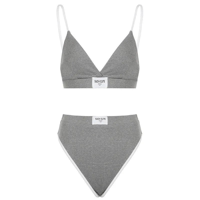 Grey women's embroidered bikini set with contrast binding, sleeveless top and shorts.