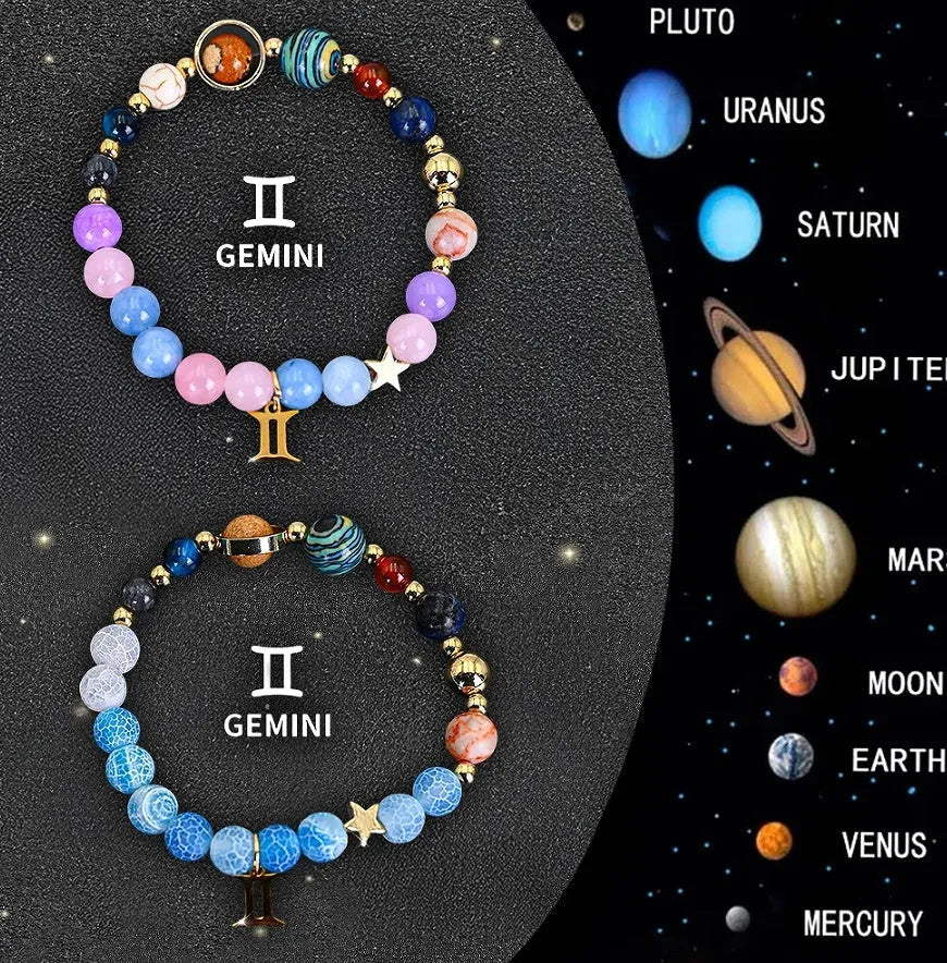 Two natural stone beaded bracelets showing zodiac sign designs on a wooden surface.