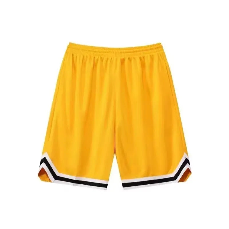 Man wearing loose fit grey polyester sports shorts on a summer day.
