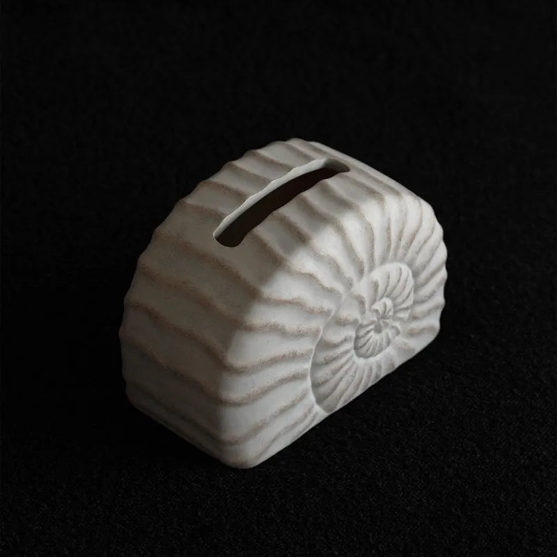 Conch ramble coloured resin decorative tissue box holder with a modern simple design.