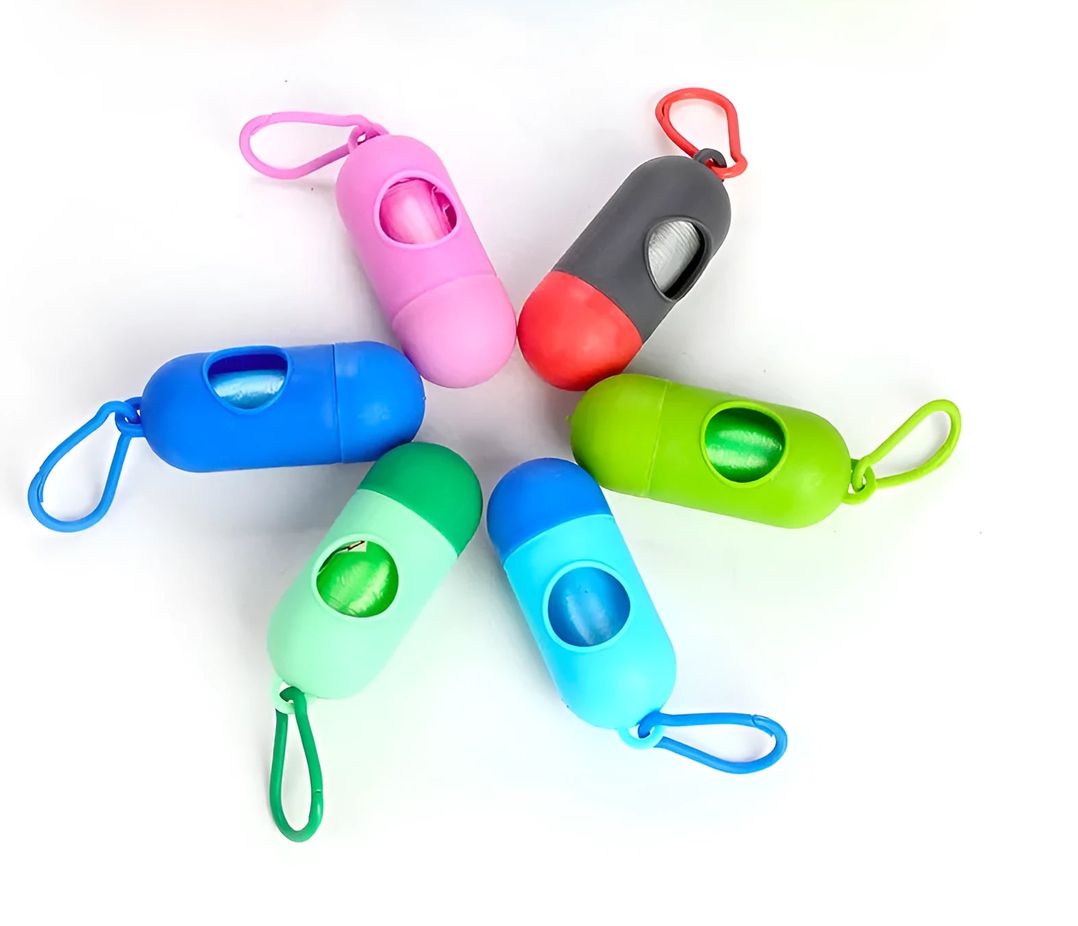 Roll of multi-coloured dog waste bags showing black, blue, green, and pink examples