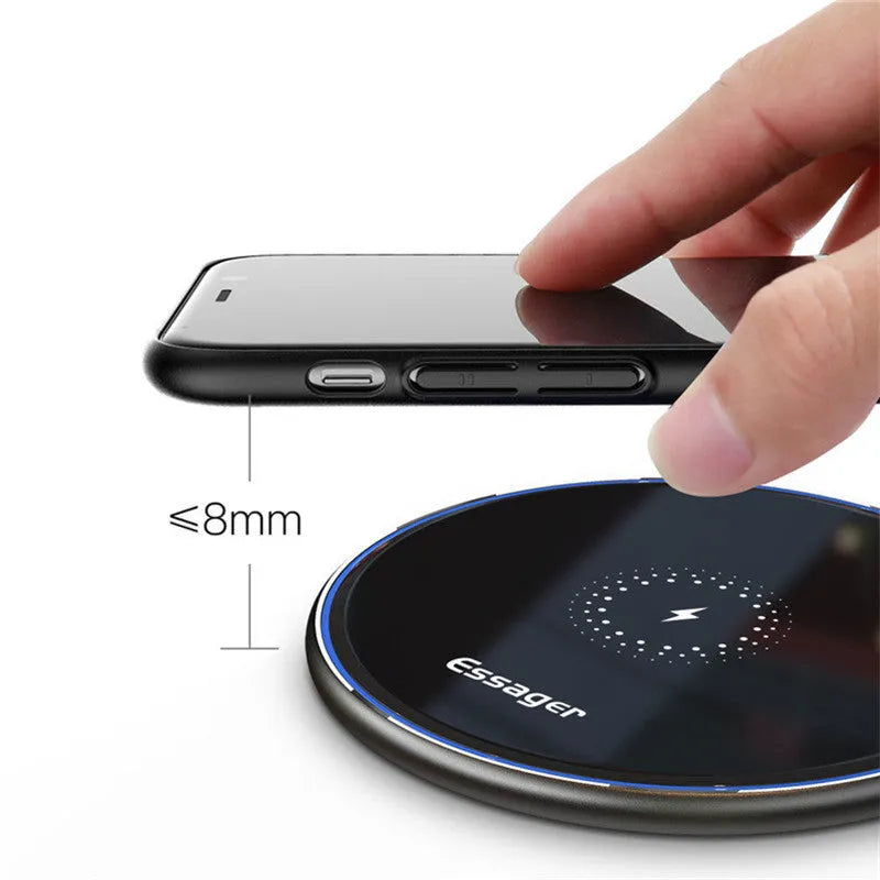 Black or white aluminium wireless charging pad showing soft LED light, for phones and headphones.