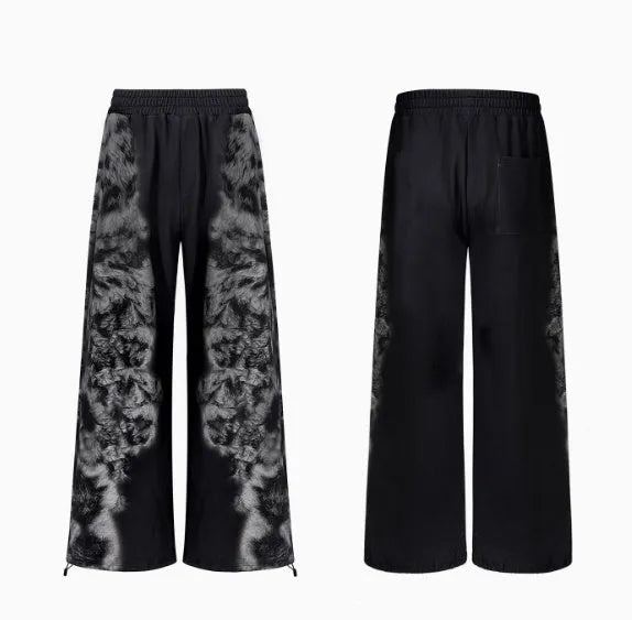 Loose fit streetwear co-ord set showing shorts, trousers, and hoodie with collage stitching detail