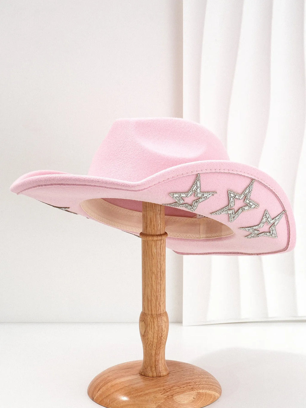 Beige polyester western denim top hat with a conical crown and a silver hexagonal star decoration on the front.