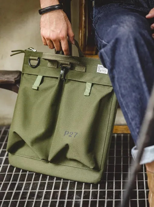 Marden Tooling charcoal black canvas messenger bag with crossbody strap, shown open to reveal laptop compartment.