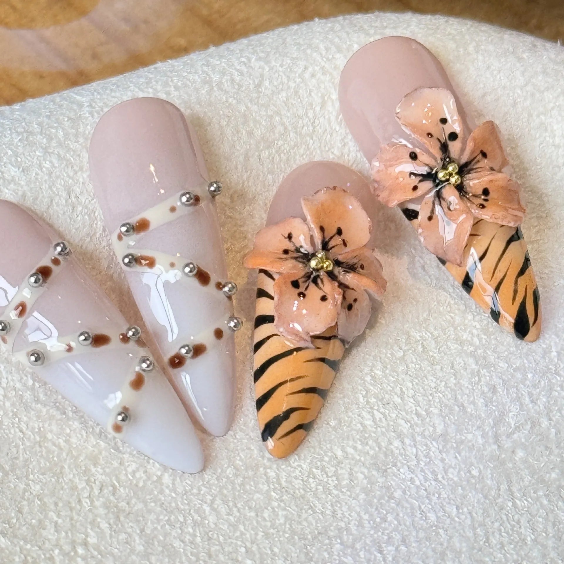 Leopard print press-on nails with cross and flower patterns in four sizes
