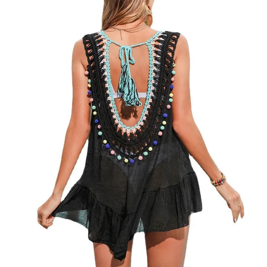 Black hand-crocheted women's beach cover-up vest with ruffled cut-out design.
