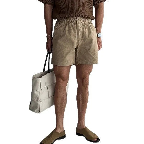 Men's loose fit cotton sports shorts in black, white, or khaki for summer wear