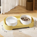 Green ceramic elevated cat bowls with 15 degree tilt on non-slip base