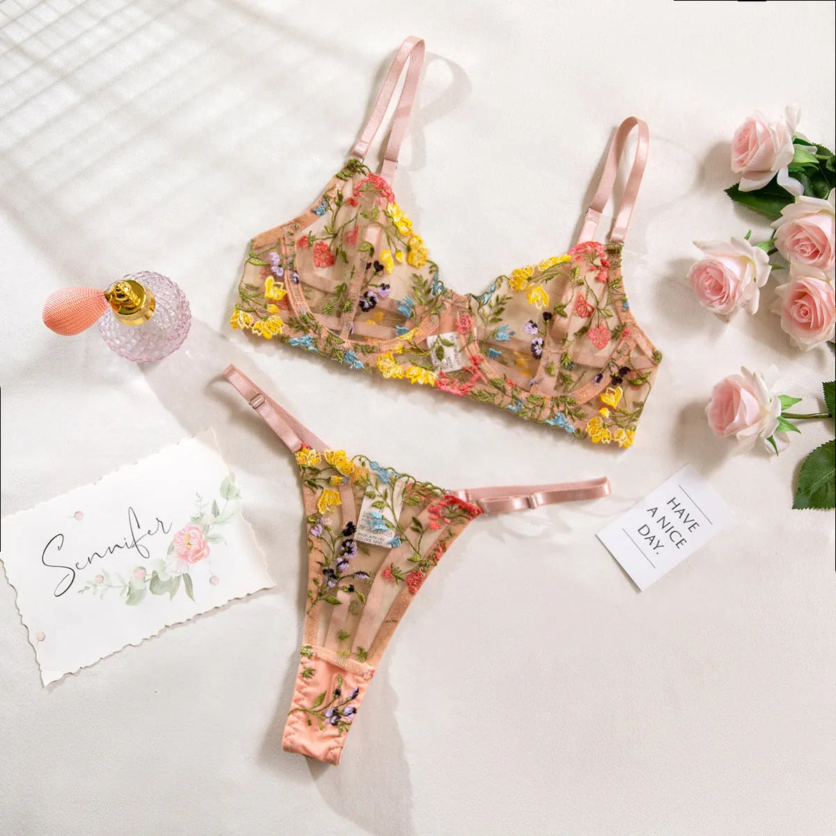 Floral patterned mesh bra and T-back underwear set in a skin colour, showing steel ring detail.