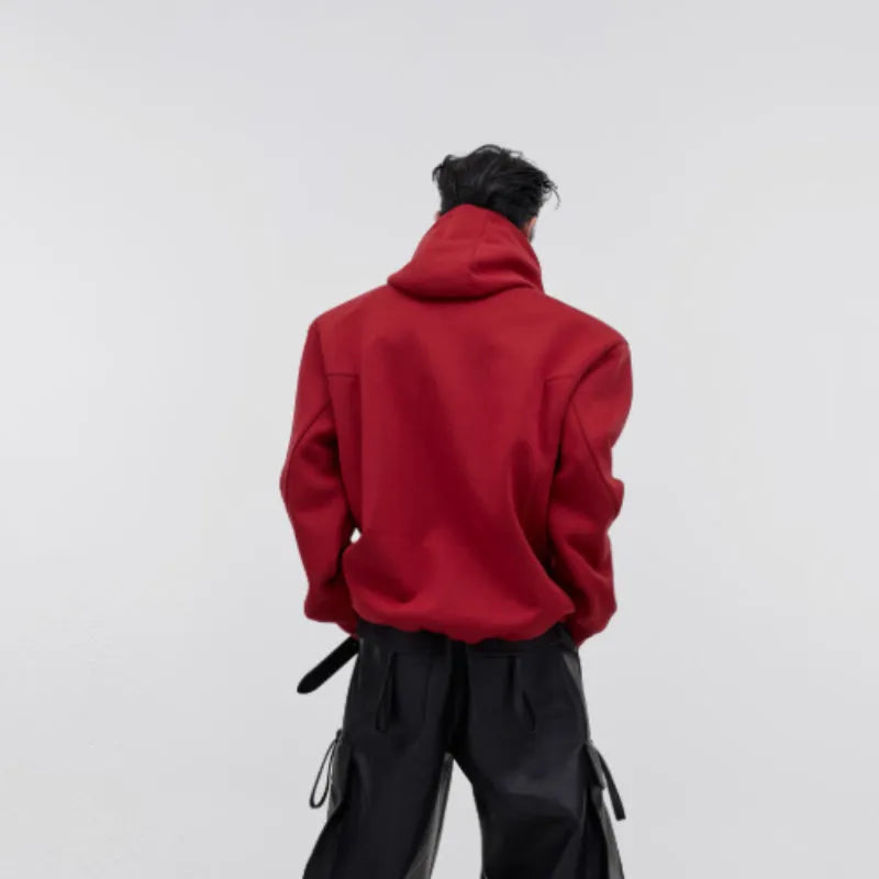 Men's black hooded sweater with metal 3D printing design and structured shoulder pads.