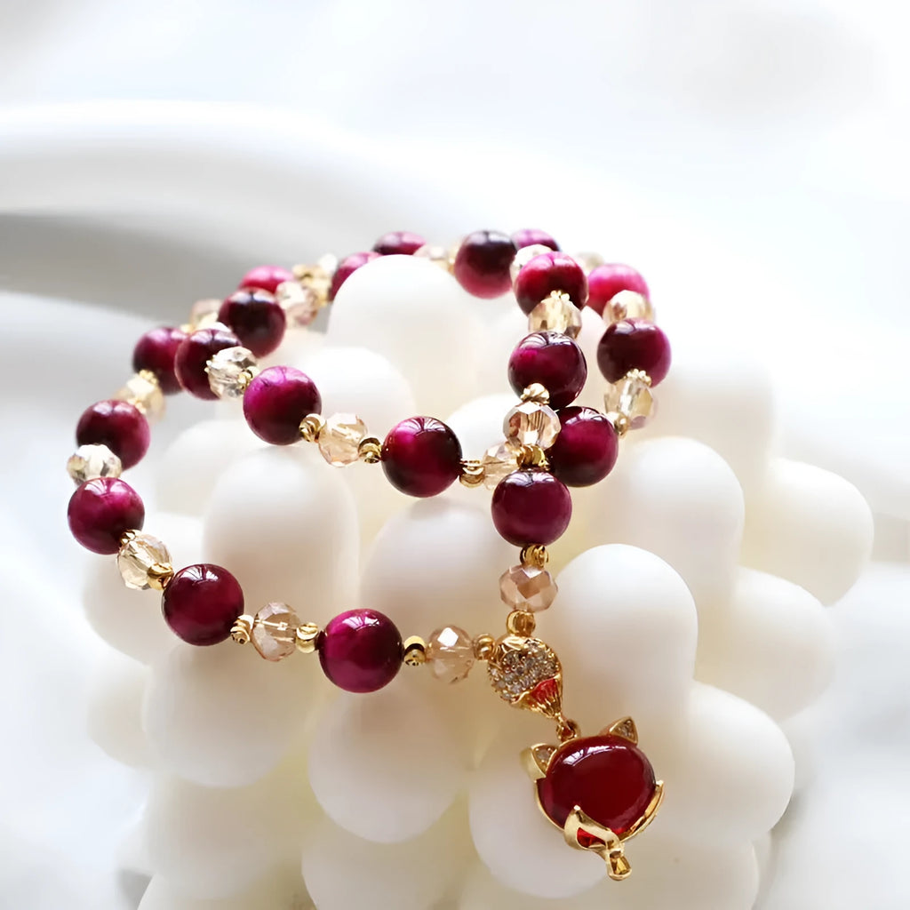 Handmade natural Vanves stone Tigereye bracelet on wrist showing single or double chain with fox motif.