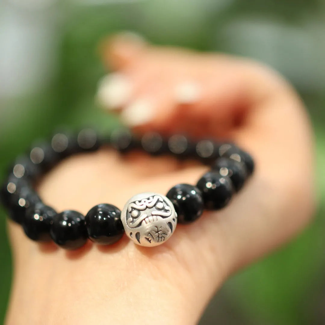 Natural black agate beaded bracelet with sterling silver clasp showing Chinese style threading