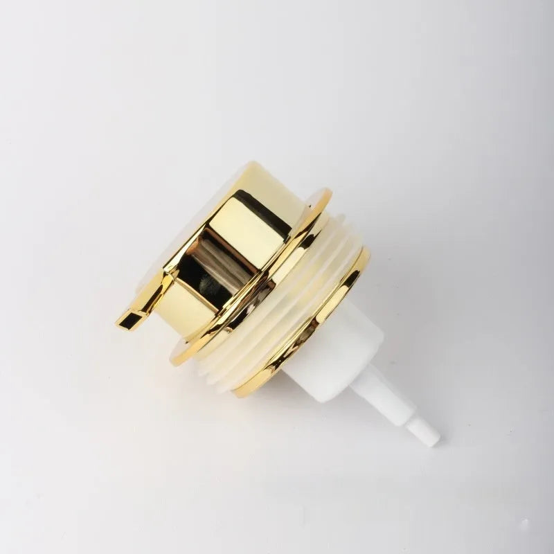 Facial cleanser foam pump with large plastic head in various metallic finish options.
