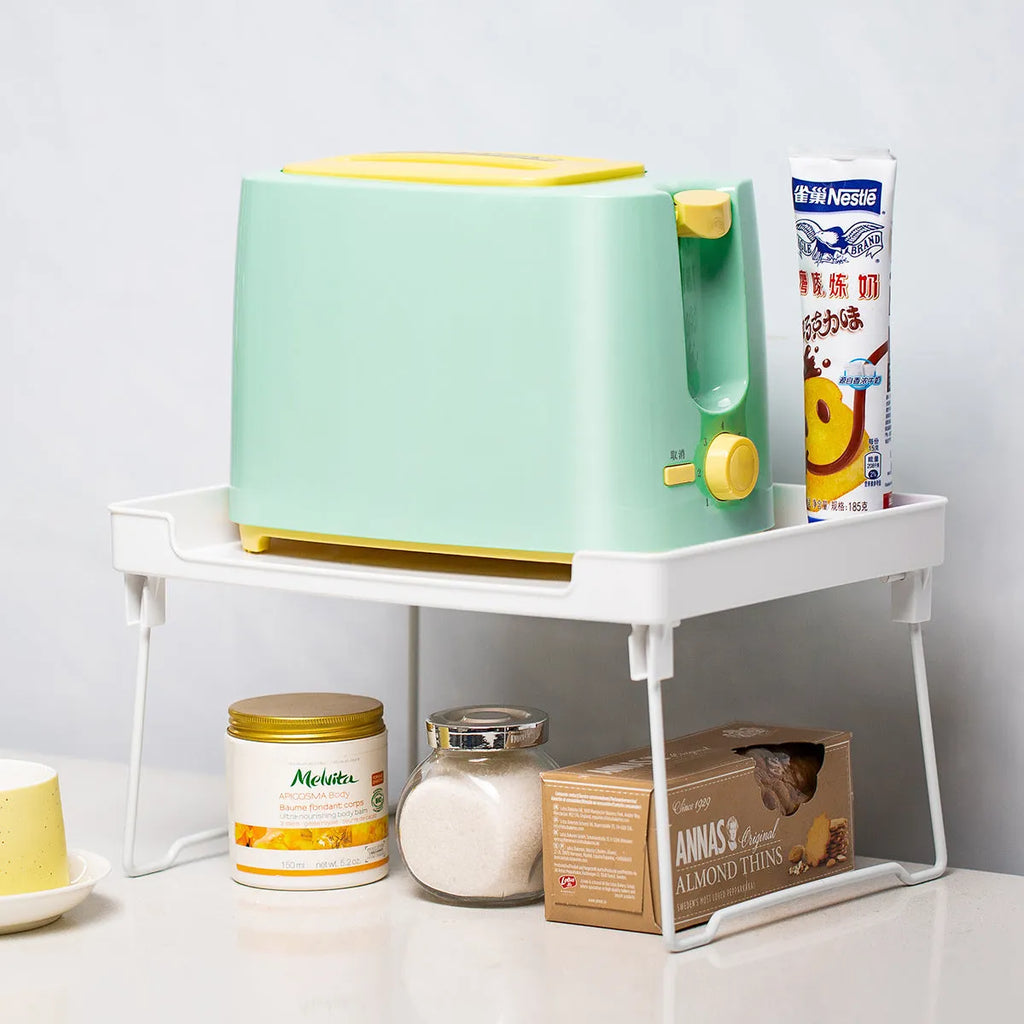 White and transparent plastic kitchen shelf organiser rack for countertop or cupboard storage