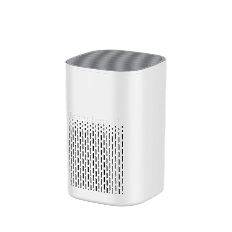 Simple style USB desktop air purifier and deodorant machine with panel heating on a desk.