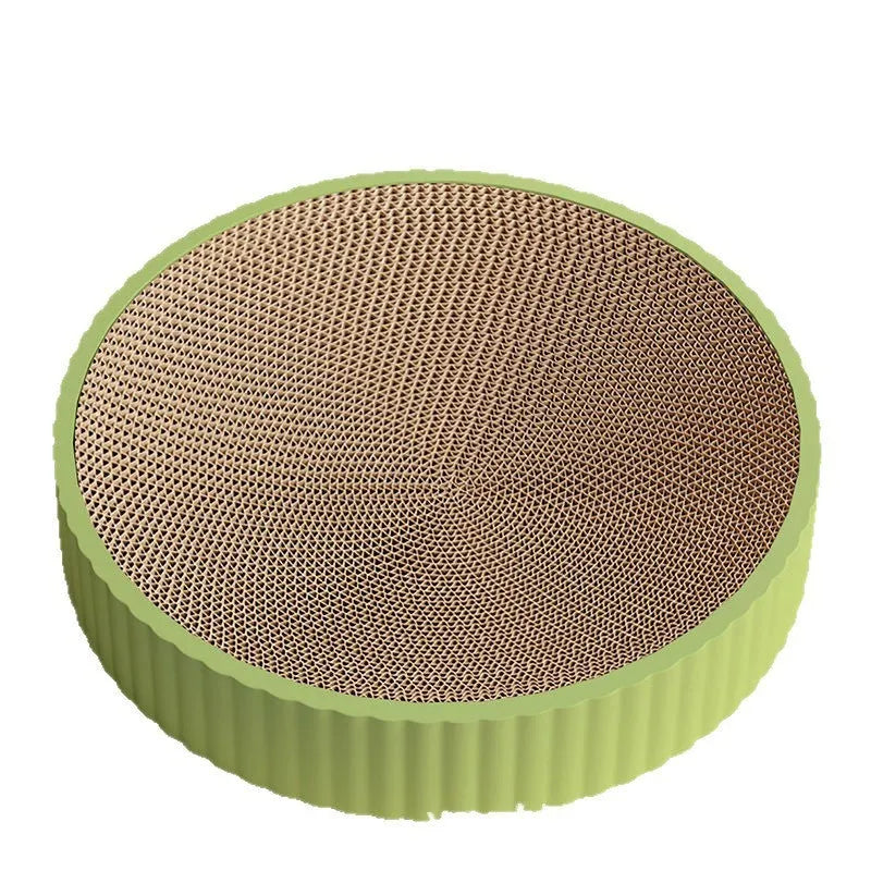 Green and white round cat scratching board with corrugated cardboard surface measuring 55cm across