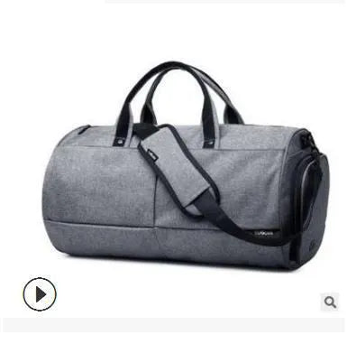 Men's black waterproof canvas gym travel bag with zipper pockets and soft handles