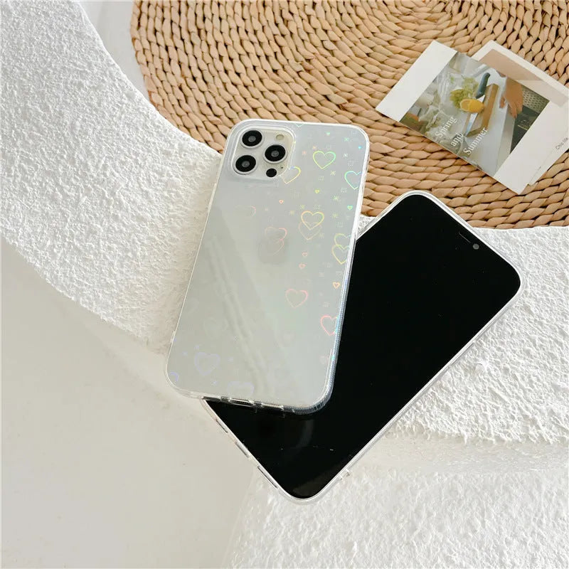 Transparent silicone iPhone case with a laser-etched love pattern, shown fitted on a phone.
