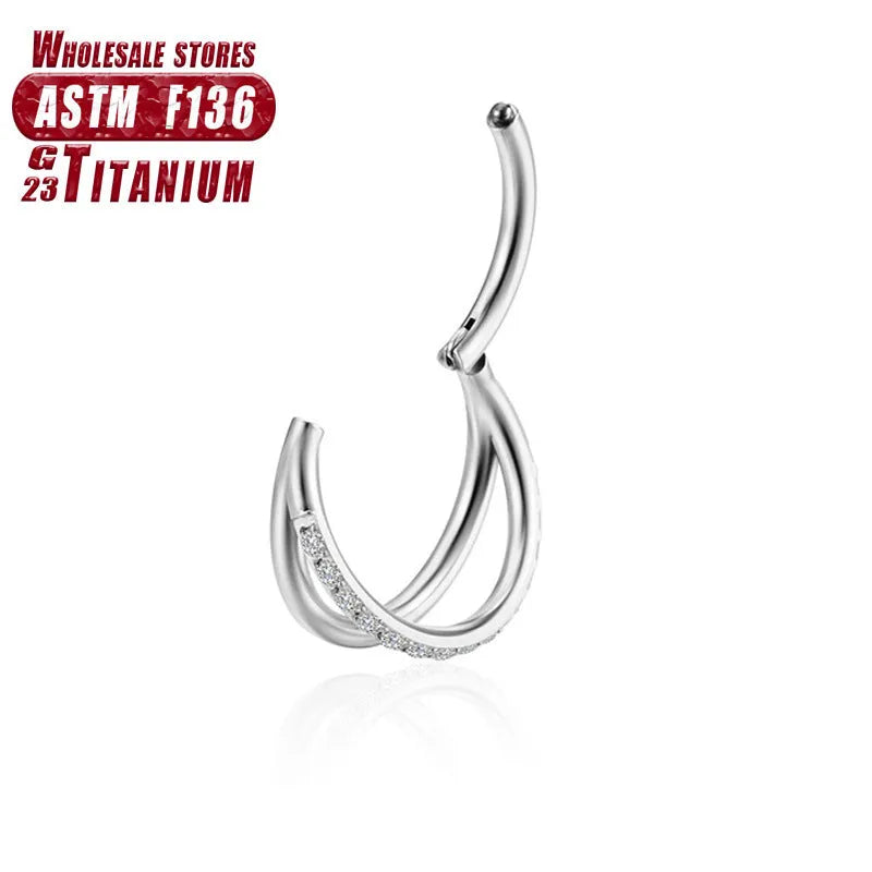 Titanium alloy nose ring piercing jewellery on a plain background showing silver and rose gold colour options.