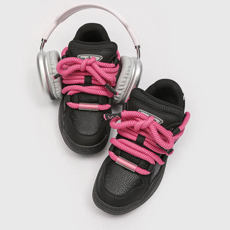 Pair of casual unisex lace-up shoes with thick rubber sole, shown in a choice of colours.