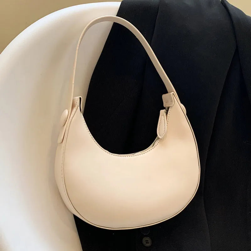 Retro-style women's dumpling-shaped shoulder bag in PU, shown in one of four colours.