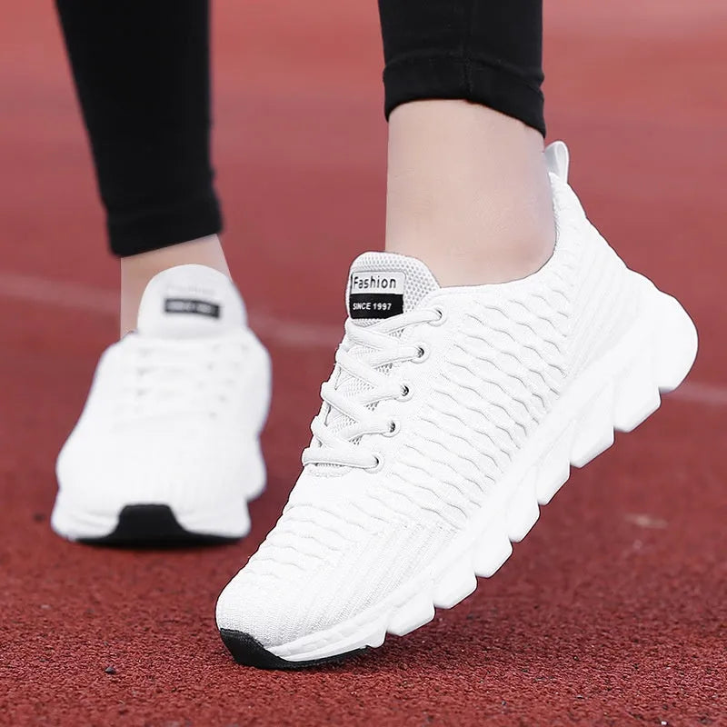 Women's running shoes in black, pink, or white with a fly weaving upper and wear-resistant outsole.
