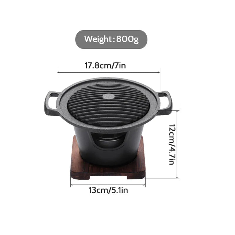 Mini BBQ grill alcohol stove with double-head flame and non-stick plate on tabletop
