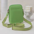 Small solid colour PU leather crossbody bag for women in black, shown with shoulder strap.