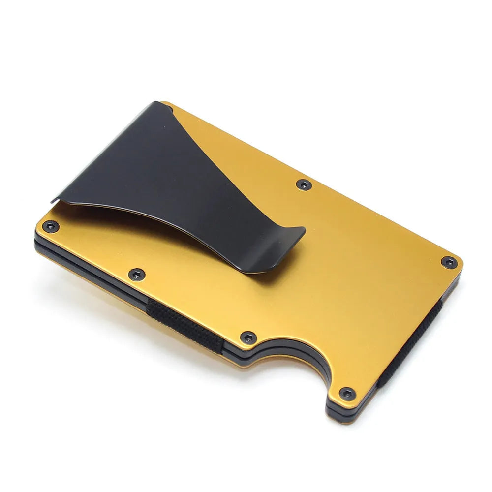 Slim black carbon fibre card holder wallet with geometric design on a table.