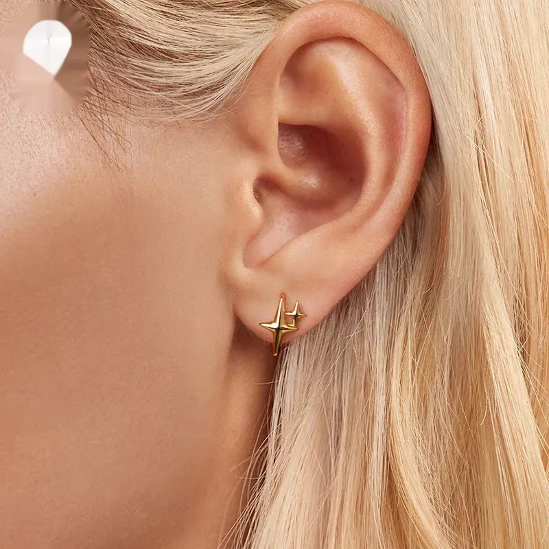 Minimalist star design silver ear clips with XINGX element detail and clip-on back