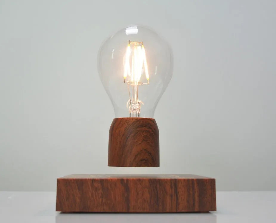 Magnetic levitation floating bulb lamp with imitation wood base and glass construction