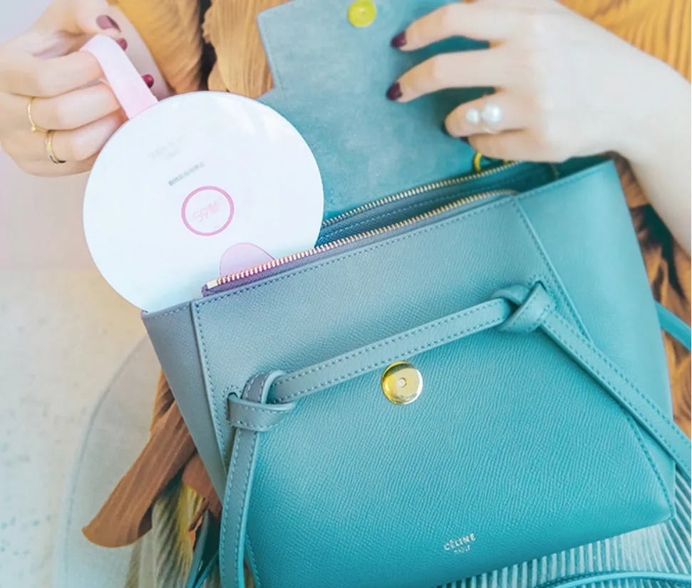 Portable UV baby bottle steriliser in blue or pink, showing compact size and USB port.