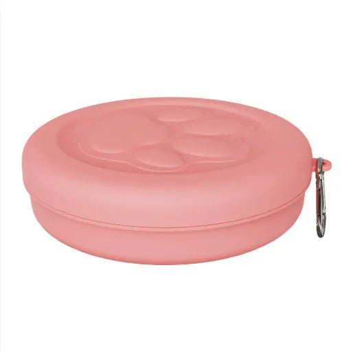 Portable outdoor dog bowl set in light green and pink, showing food bowl, water dish, and snack box compartment.