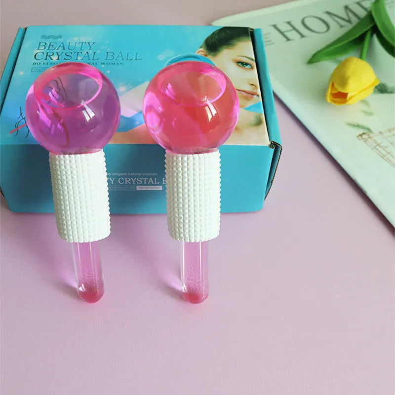 Set of two beauty ice wave ball face massage tools in purple flash finish on white background