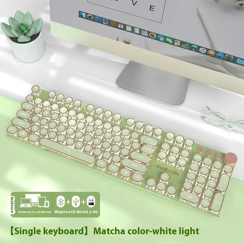Matcha green mechanical gaming keyboard with multifunction knob on a desk