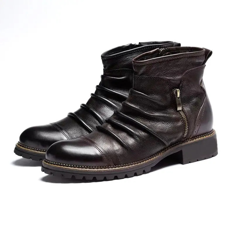 Black cowboy boots with side zip closure, embossed PU uppers, and horseshoe heel on wooden floor