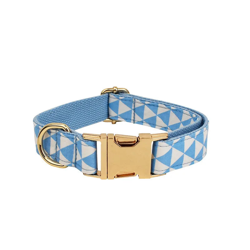 Blue cloth dog vest with triangular rope design, matching collar, leash and bow in a four-piece pet accessory set