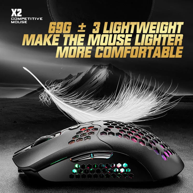 Free Wolf X2 wireless gaming mouse with honeycomb shell in multiple colours on a desk.