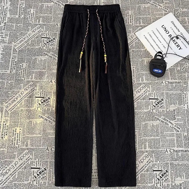 Men's thin loose straight trousers with Korean style folding craft in black and white options