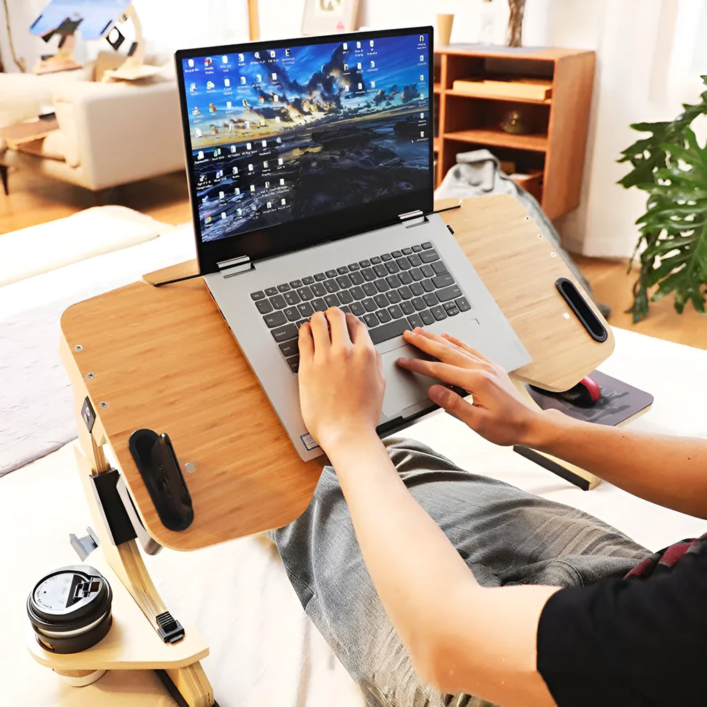 Wooden folding computer table with adjustable angle on bed, showing modern simple design