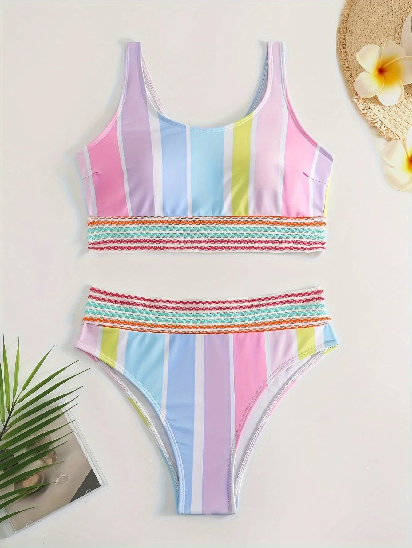 Women's striped bikini swimwear set with top and briefs for swimming sports.