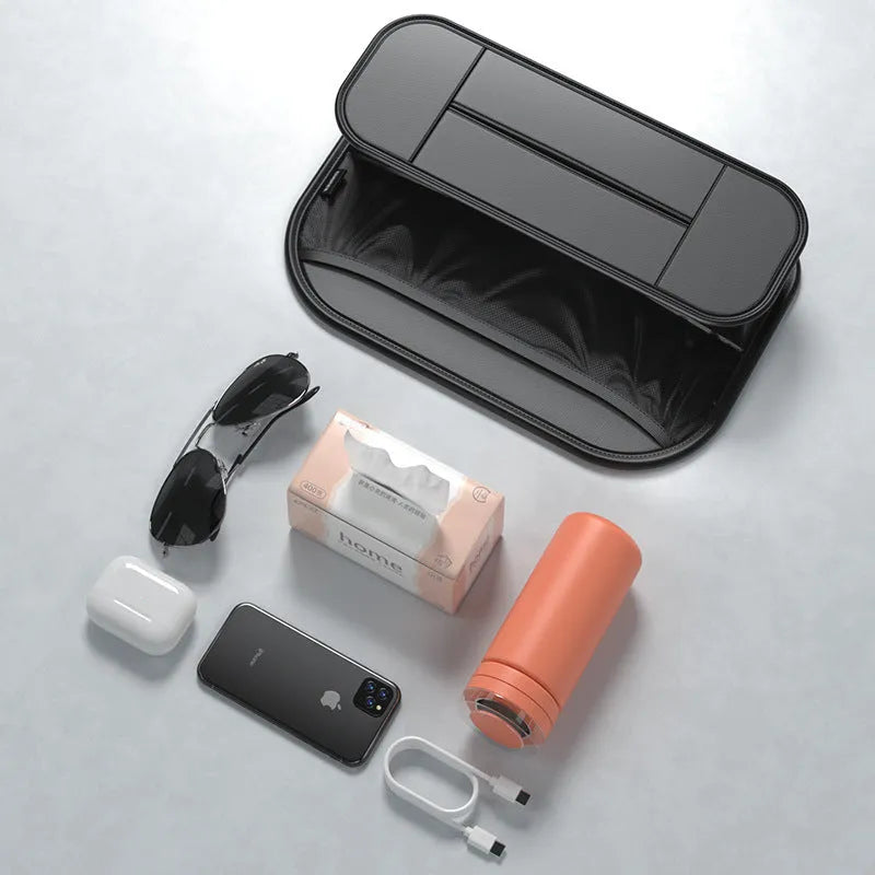 Black leather car seat back storage bag with organisable pockets for vehicle use.