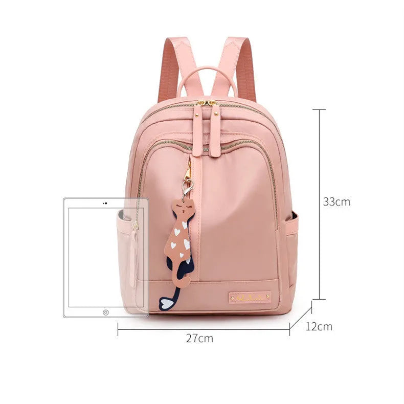 Women's black casual nylon backpack with shoulder straps showing external pockets and organised interior compartments